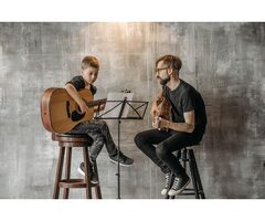 Guitar Lessons for Beginners — First Class Free